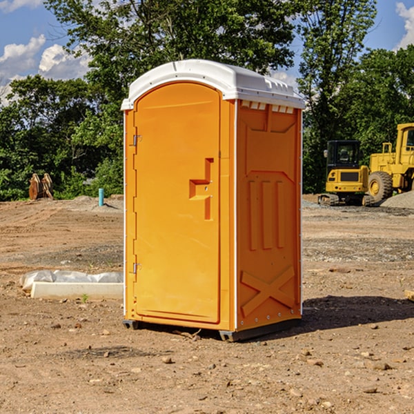 what is the cost difference between standard and deluxe portable toilet rentals in Rush City MN